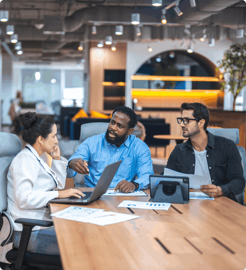 Colleagues collaborating at work table